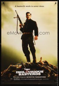 3y484 INGLOURIOUS BASTERDS teaser DS 1sh '09 Quentin Tarantino, Brad Pitt standing on pile of Nazis