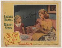 3z054 GIFT OF LOVE signed LC #8 '58 by Lauren Bacall, who's giving tea to an Evelyn Rudie!