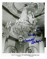 3z350 CARROLL BAKER signed 8x10 still '63 sexy & barely dressed on chandelier from Carpetbaggers!