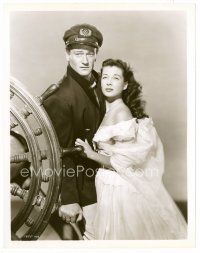 4h741 WAKE OF THE RED WITCH 8x10 still '49 close up of John Wayne & Gail Russell at ship's wheel!