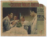 9d326 CREATURE WALKS AMONG US LC #4 '56 four guys examine wounded monster on operating table!
