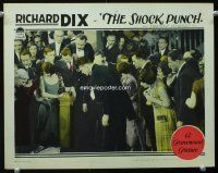 9d781 SHOCK PUNCH LC '25 large crowd looks shocked at unconscious man on floor!
