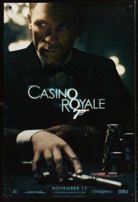 9k137 CASINO ROYALE teaser DS 1sh '06 Daniel Craig as James Bond sitting at poker table w/gun!