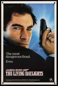 9k439 LIVING DAYLIGHTS teaser 1sh '87 super close up of Timothy Dalton as James Bond with gun!