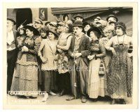 1c026 DOG'S LIFE 8x10 LC '18 c/u of Charlie Chaplin holding leash in a large crowd of women!