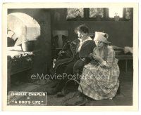 1c025 DOG'S LIFE 8x10 LC '18 Charlie Chaplin with pipe sitting by Edna Purviance by fire!