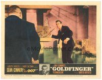 2p538 GOLDFINGER LC #4 '64 Sean Connery as James Bond about to throw stick at Harold Oddjob Sakata