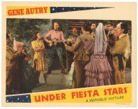 2p955 UNDER FIESTA STARS LC '41 cowboy Gene Autry plays his guitar for Carol Hughes & crowd!