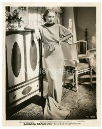 2s101 BARBARA STANWYCK 8x10 still '34 full-length in sexy dress posing by cool amoire!