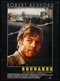 3b596 BRUBAKER Danish '80 warden Robert Redford is the most wanted man in Wakefield prison!