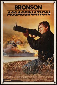 3f055 ASSASSINATION 1sh '86 Jill Ireland, close-up of Charles Bronson with rocket launcher!