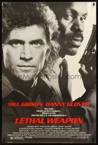 3f427 LETHAL WEAPON 1sh '87 great close image of cop partners Mel Gibson & Danny Glover!