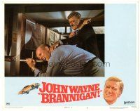 3e236 BRANNIGAN LC #8 '75 great close up of big John Wayne restraining bad guy!