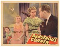 3e324 DANGEROUS CORNER LC '34 Virginia Bruce & Betty Furness stare at Melvyn Douglas in tuxedo!