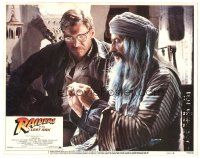 3e735 RAIDERS OF THE LOST ARK int'l LC #7 '81 Tutte Lemkow explains pendant to Harrison Ford!