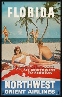 4j324 NORTHWEST ORIENT AIRLINES FLORIDA travel poster '60s image of couple sunbathing on shore!