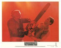 4w305 RUNNING MAN LC #4 '87 close up of Arnold Schwarzenegger fighting guy with chainsaw!