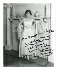 5a819 MADGE KENNEDY signed 8x10 REPRO still '86 great full-length portrait standing by fireplace!