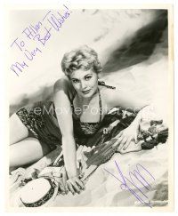 5a568 KIM NOVAK signed 8x10 still '60s close up wearing swimsuit laying in the sand on beach!
