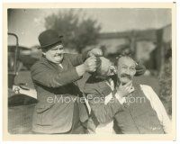 5d182 BIG BUSINESS 8x10 still '29 Oliver Hardy stops Stan Laurel biting James Finlayson's ear!