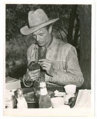 5d266 DALLAS candid 8x10 still '50 Gary Cooper in costume feeding bird from his lunch tray!
