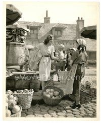 5d741 PASSAGE TO MARSEILLE 8x10 still '44 Michele Morgan buying cabbage at market by Jack Woods!