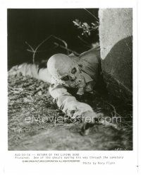 5d783 RETURN OF THE LIVING DEAD 8x10 still '85 c/u of a ghoul making its way through the cemetery!