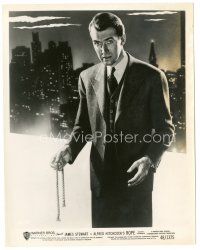 5d806 ROPE 8x10 still '48 James Stewart holding rope by New York skyline, Alfred Hitchcock!