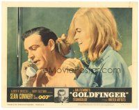 5h078 GOLDFINGER LC #2 '64 c/u of sexy Shirley Eaton behind Sean Connery as James Bond on phone!