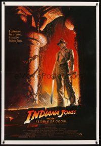 5j335 INDIANA JONES & THE TEMPLE OF DOOM linen 1sh '84 adventure is Ford's name, Bruce Wolfe art!