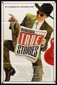 7h921 TRUE STORIES style B 1sh '86 image of star & director David Byrne reading newspaper!