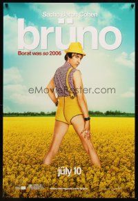 7p172 BRUNO teaser DS 1sh '09 image of wacky Sascha Baron Cohen in field of flowers!