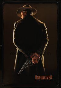 7p756 UNFORGIVEN undated teaser 1sh '92 classic image of gunslinger Clint Eastwood w/back turned!