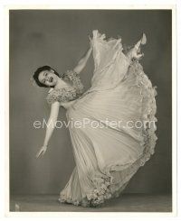 7s437 JEANNE CAGNEY 8x10 still '40s in great flowing dress kicking her leg in the air by Welbourne