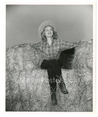 7s466 JUNE HAVER 8x10 still '40s smiling c/u in cowgirl outfit sitting on hay bales by Mac Julien!