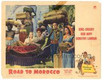 9f161 ROAD TO MOROCCO LC '42 Bob Hope is porter for Bing Crosby & Dorothy Lamour in sedan chair!