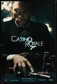 9k084 CASINO ROYALE teaser DS 1sh '06 Craig as James Bond sitting at poker table w/gun!