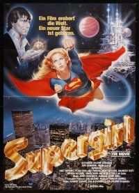 9m639 SUPERGIRL German '85 Casaro art of super Helen Slater in costume flying over NYC!