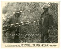 9t807 OUTLAW JOSEY WALES 8x10 still '76 close up of two men holding rifles on Clint Eastwood