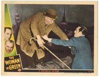 9y986 WOMAN IN GREEN LC '45 Basil Rathbone as Sherlock Holmes helps Nigel Bruce as Watson on ledge