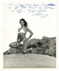 1r0507 CAROLINE MUNRO signed 8.25x10 still '70s sexy kneeling portrait wearing a skimpy bikini!