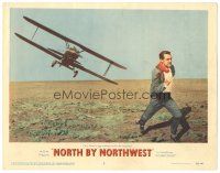 2h069 NORTH BY NORTHWEST LC #2 '59 Hitchcock, classic c/u of Cary Grant chased by crop duster!