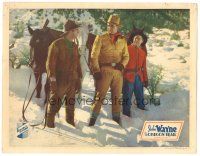 2k040 OREGON TRAIL LC '36 big John Wayne with a Mountie & other guy standing in the snow!