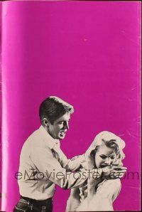 2y122 CARPETBAGGERS pressbook '64 great close up of Carroll Baker biting George Peppard's hand!