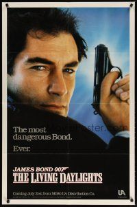 3b482 LIVING DAYLIGHTS teaser 1sh '87 super close up of Timothy Dalton as James Bond with gun!