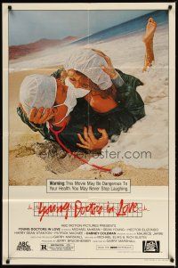 3b989 YOUNG DOCTORS IN LOVE 1sh '82 Michael McKean, Sean Young,doctors in scrubs making out on beach