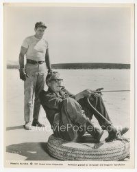 3k618 MISFITS candid 8x10.25 still '61 John Huston smoking cigar sitting on big tire with rope!