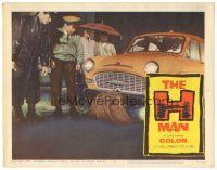 3w264 H MAN LC #7 '59 four people gather to examine man under taxi cab in the rain!