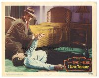 3y562 I LOVE TROUBLE LC #7 '47 close up of Franchot Tone checking unconscious man's pulse!