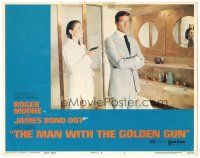 3y657 MAN WITH THE GOLDEN GUN LC #1 '74 sexy Maud Adams points gun at Roger Moore as James Bond!